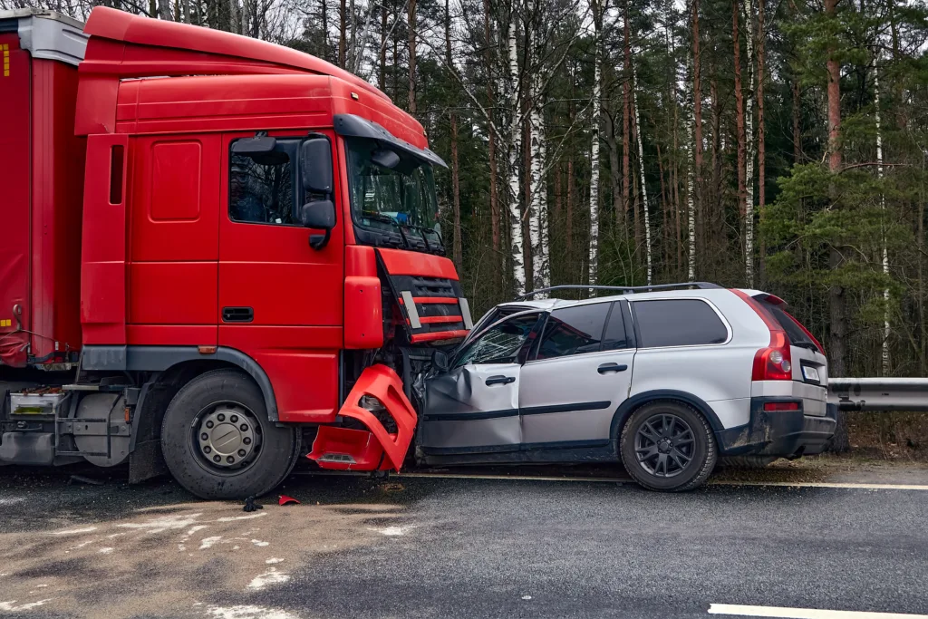 Truck and SUV collision on roadside with visible front-end damage, illustrating serious car accident and traffic crash scene
