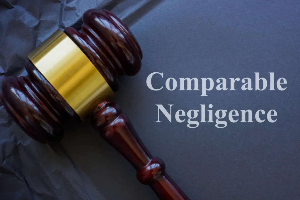 Judge’s gavel on dark background with text “Comparative Negligence,” representing personal injury law concept.