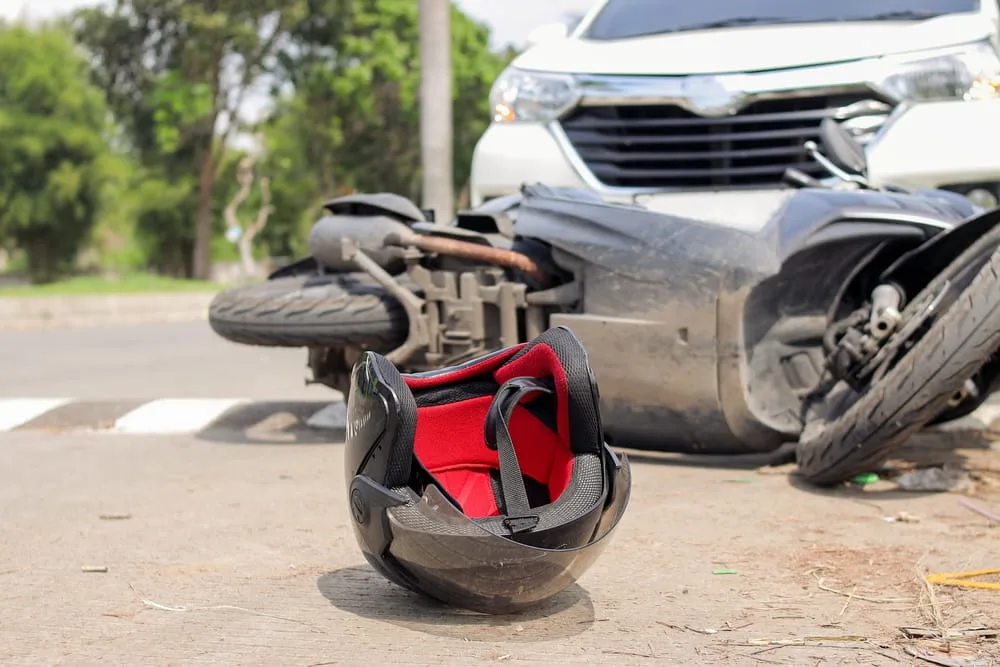 Motorcycle helmet and wreckage at the scene of a fatal traffic collision