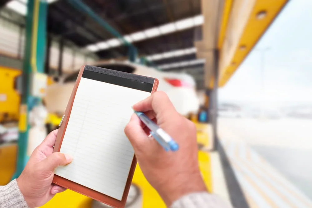 Commercial truck inspector reviewing fleet records before a Texas 18-wheeler operation